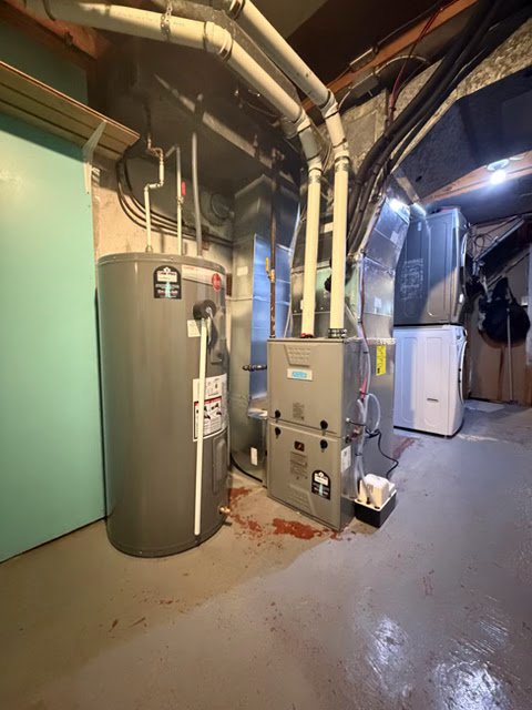 Technician servicing AC condenser